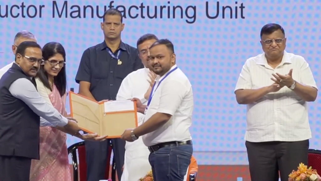Soham Biswas receiving official land allotment document for INDNIX's Semiconductor Manufacturing Unit at the West Bengal Government ceremony